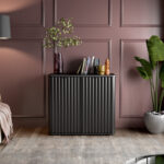 Black sideboard with ribbed fluted doors. Small black buffet cabinet